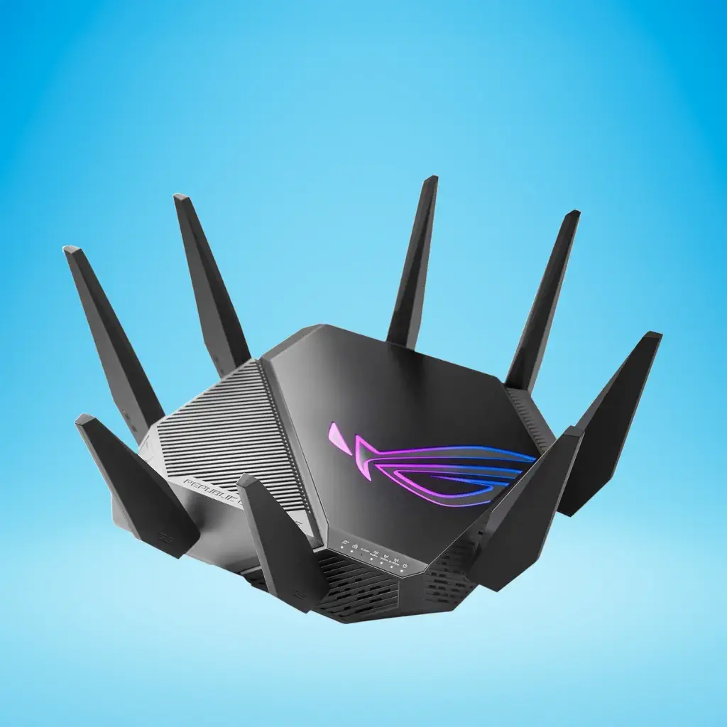 A black, angular ASUS ROG Rapture GT-AXE11000 gaming router with six external antennas and a glowing ROG logo, floating against a blue background.