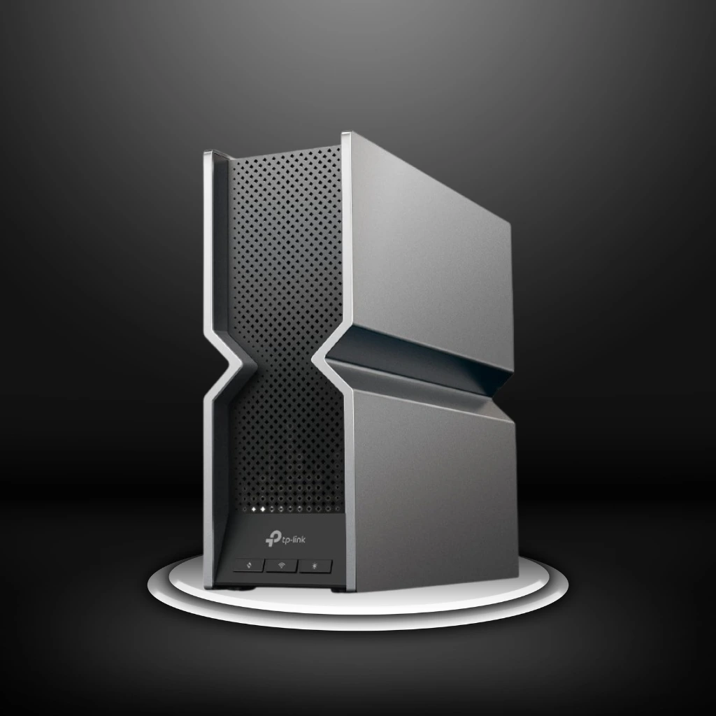 A modern, silver and black TP-Link Archer BE800 router with a unique, angular design, placed on a white platform against a dark background.